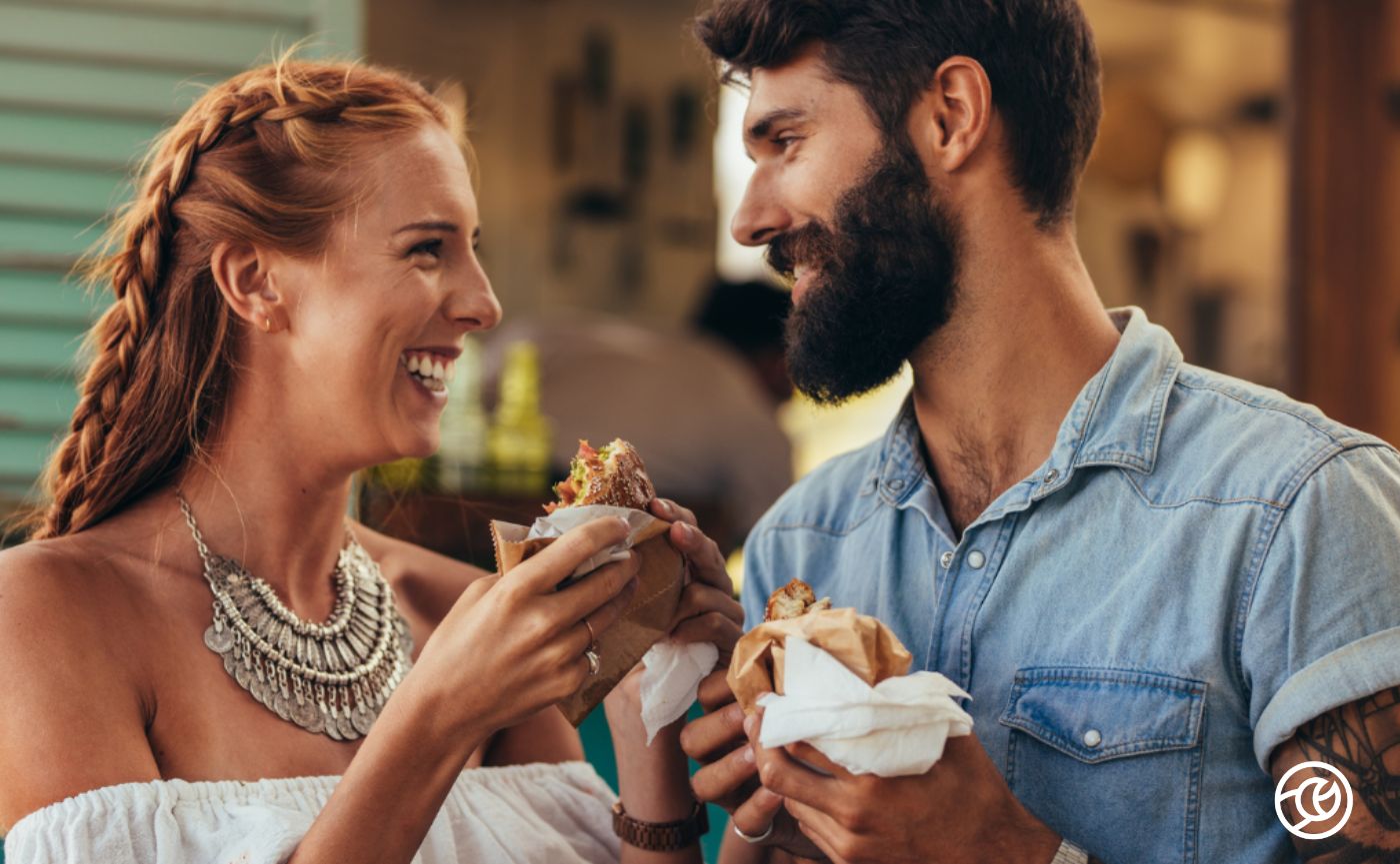 Couple eating burgers